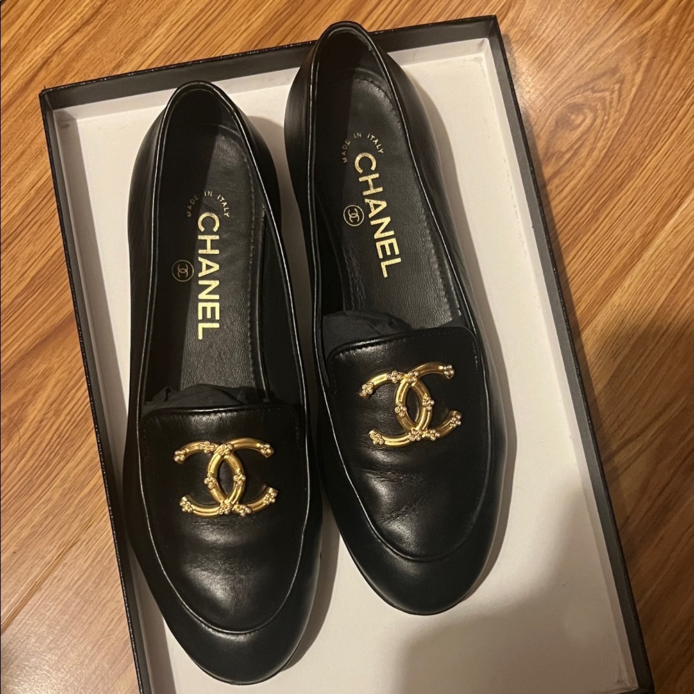 CHANEL Black Loafers with Gold Logo Accent